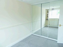 Master bedroom with built in wardrobe